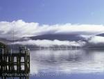 Pier and Loch Fyne on a calm autumn morning with a 
layer of cloud hanging over the water. Inveraray, 
Argyll and Bute, Scotland, UK, Europe

Keywords: Scottish coast misty tranquil scene