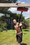 Window cleaner using a soapless pure water fed pole 
and brush window cleaning system for spotless glass 
windows. From inside looking out.