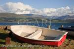 Boats on the seafront with view to the mountains of 
Snowdonia across the Menai Strait. Beaumaris, Isle of 
Anglesey, (Ynys Mon), North Wales, UK, Britain.