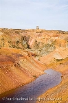Colourful minerals in rocks at disused open cast copper 
ore mine on Parys Mountain. Amlwch Isle of Anglesey 
North Wales UK Britain