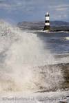 Penmon Point, Isle of Anglesey, North Wales, UK. 
Rough sea and windy weather Penmon lighthouse on 
rocky coast

Keywords: coastline, waves, big waves,