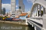 Elgin Bridge across River to Boat Quay Conservation 
Area bars and restaurants in colourful historic old 
shophouse buildings with Central Business District 
skyscrapers Singapore Asia
