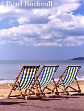 THREE DECKCHAIRS on the PROMENADE. 
Bournemouth, Dorset, England, UK, Britain

Keywords: beach coast leisure sand sea english 
seaside britain british 
