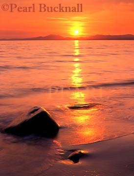 SUNSET ACROSS TREMADOG BAY from the beach. 
Llanfair, Gwynedd, Wales, UK

Keywords: sunset beach coast water sea red scenic
